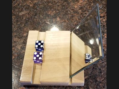 The Golden Touch Gripper — dice placement training aid